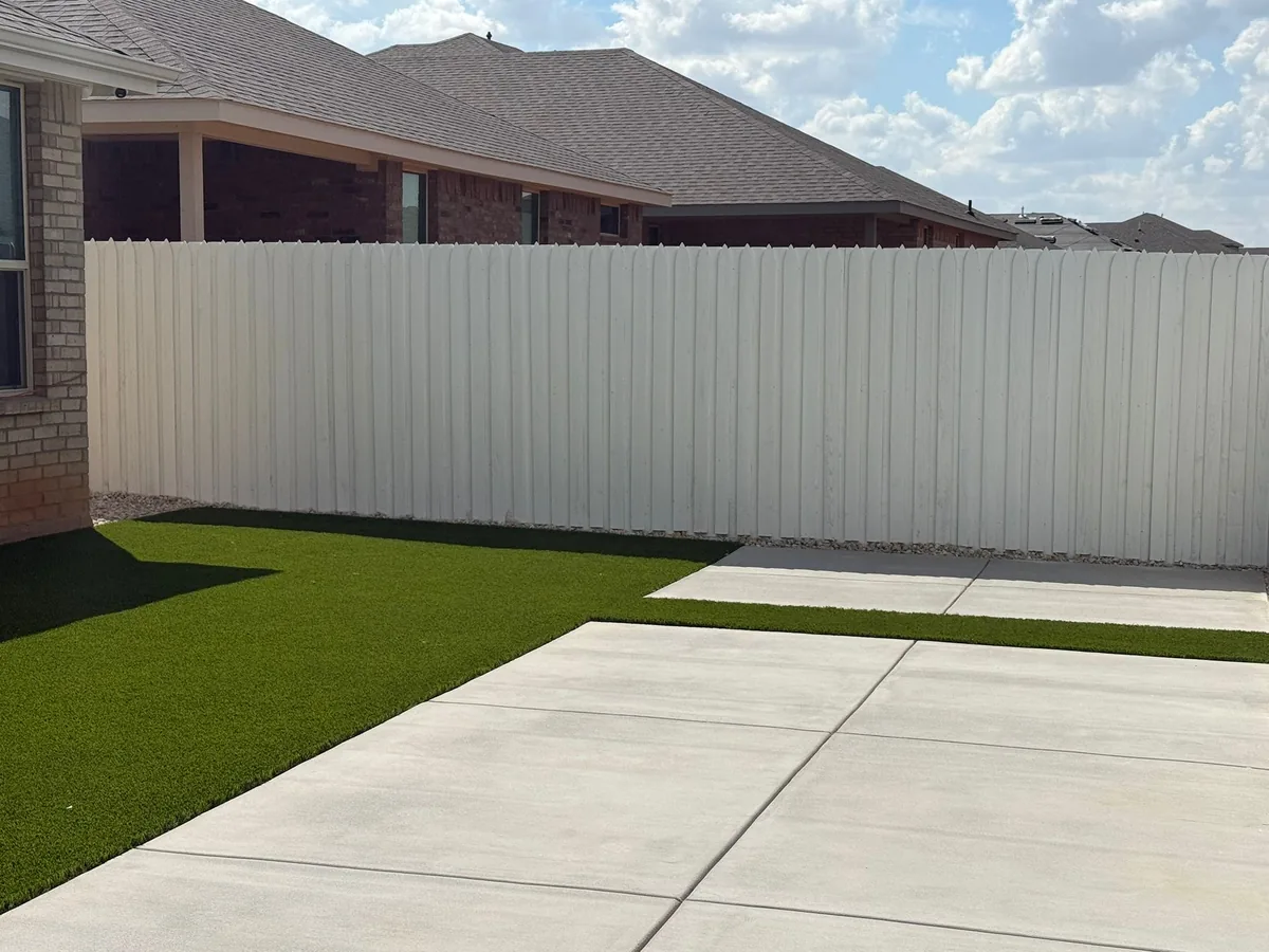 Wood privacy fence painted white